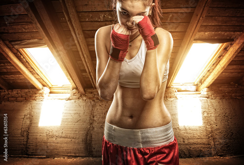Young women boxing, exercise in the attic