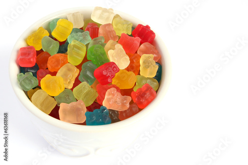 Gummy bears in white bowl on white background