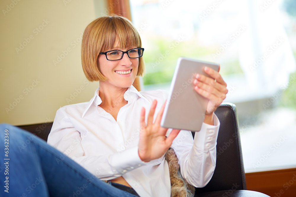 Woman with tablet at home