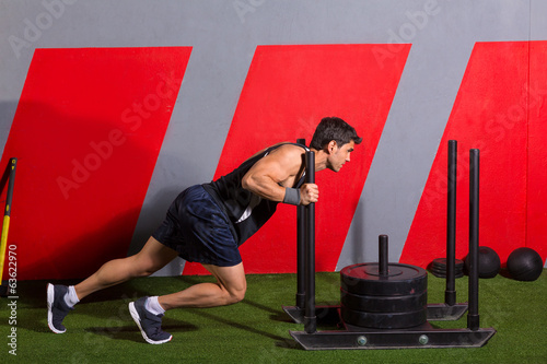 Plakat sled push man pushing weights workout exercise