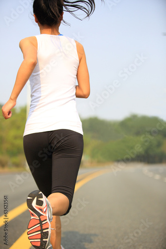 Runner athlete running on road