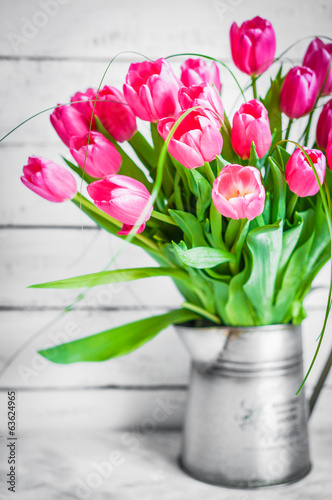 Tulips on wooden rustic background