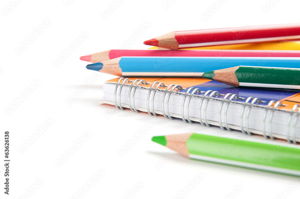 pencils and notebook on white background pencils and notebook on white background