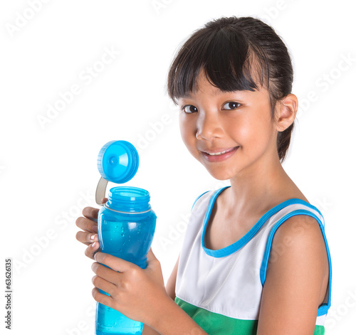 Young girl in sports attire with a bottle of water