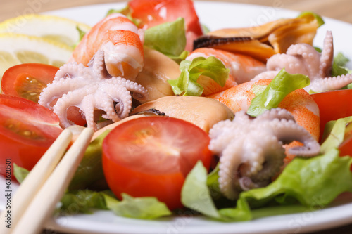Seafood salad with cherry tomatoes horizontal. Macro