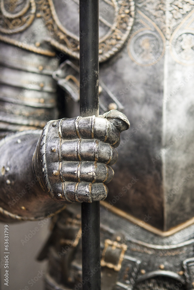 Detail of a medieval knight armor with sword Detail of a medieval knight armor with sword
