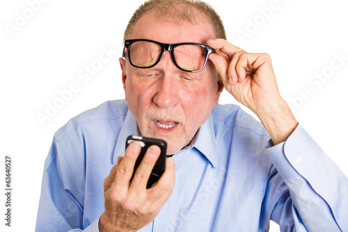 Blind old man. Headshot aging guy has difficulty reading  text