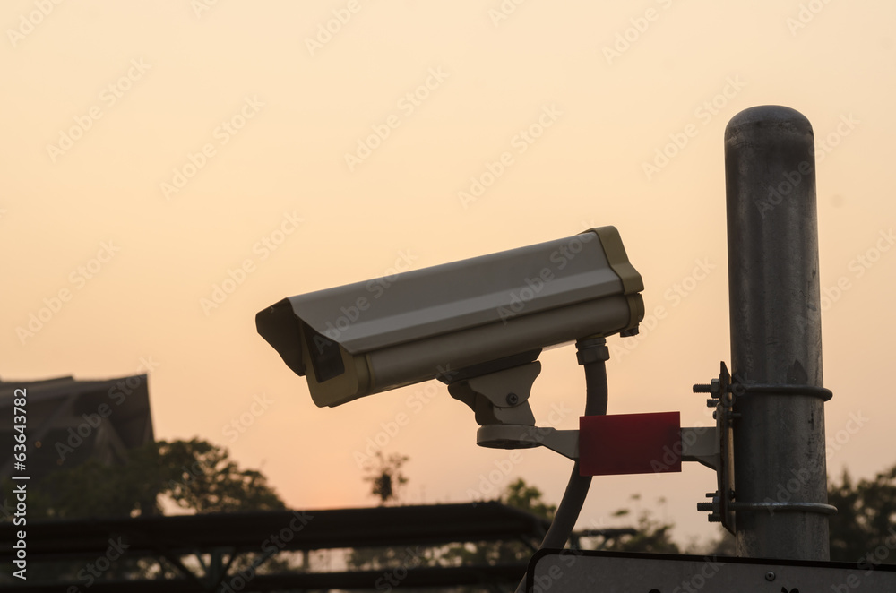 Security Camera CCTV wit sky sunset