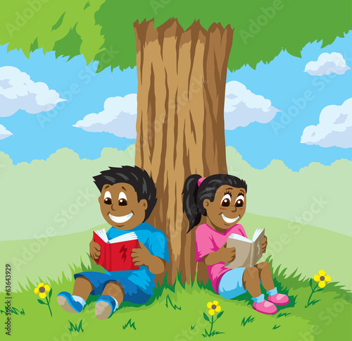Cute kids reading under a tree