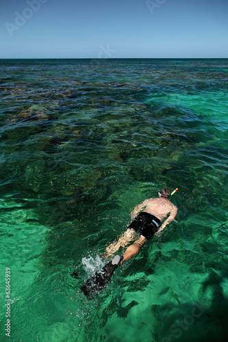 Single Caucasian man snorkeling in the ocean