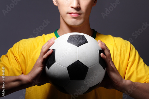 sport man smile and holding soccer © ryanking999