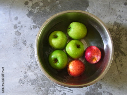 apple in bowel on cement background