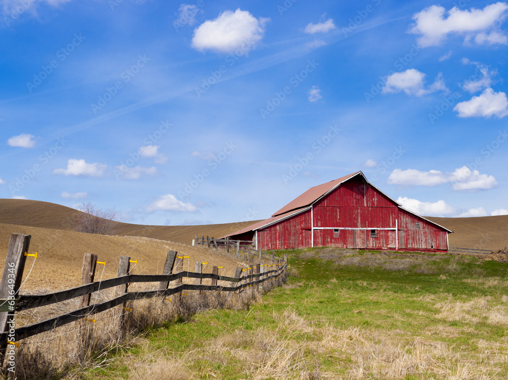 Red barn and blue sky.