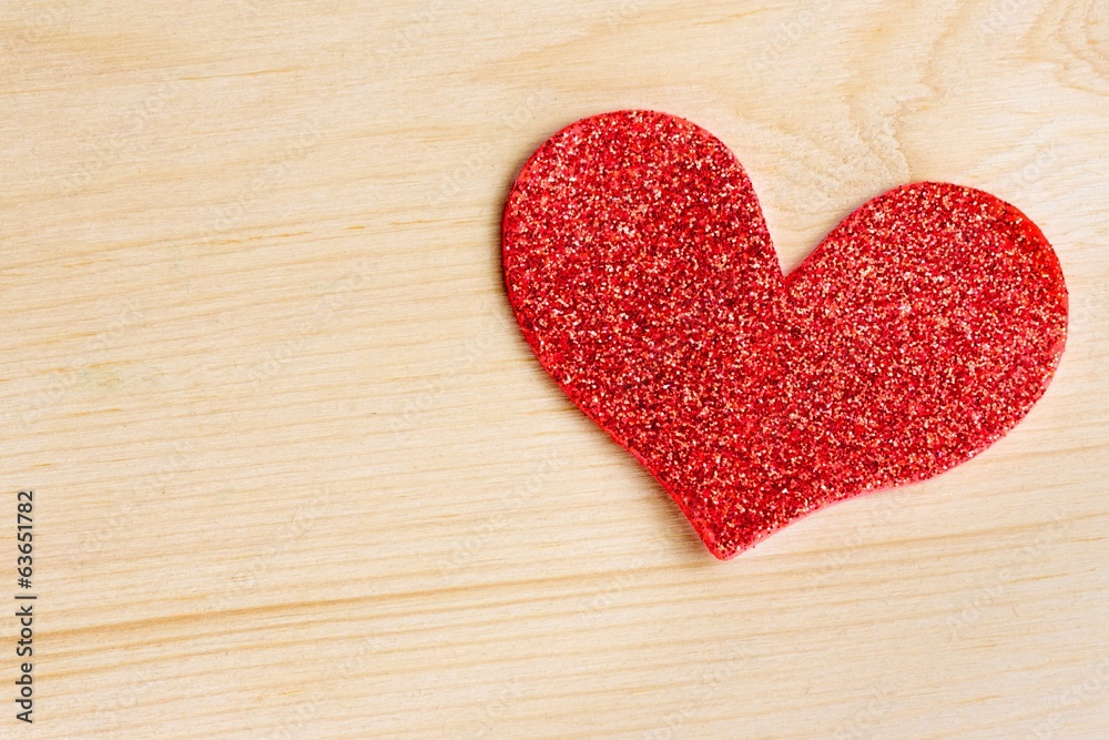 one decorative red heart on wood background, concept of love one decorative red heart on wood background, concept of love