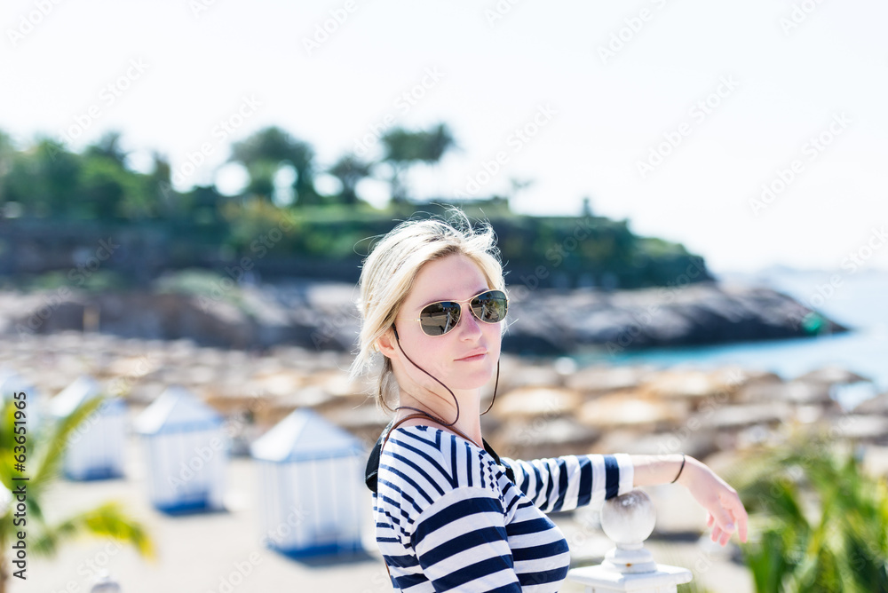 blond woman in aviator sunglasses