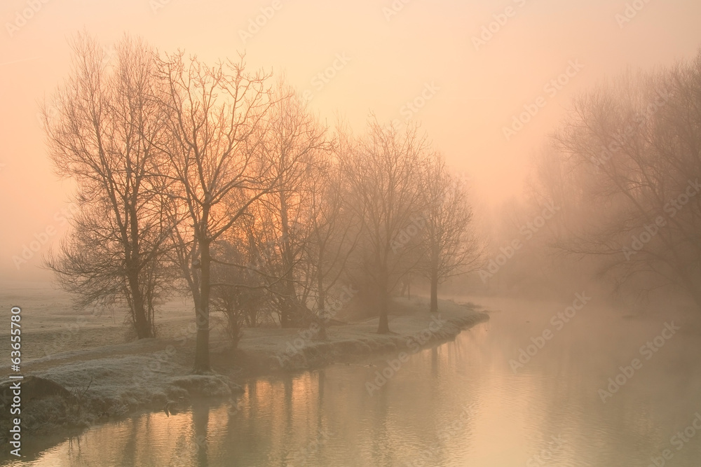Foggy river Thames near Oxford on a winter morning.