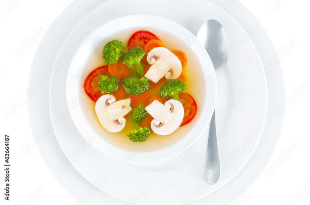 Mushroom soup with vegetables on white background