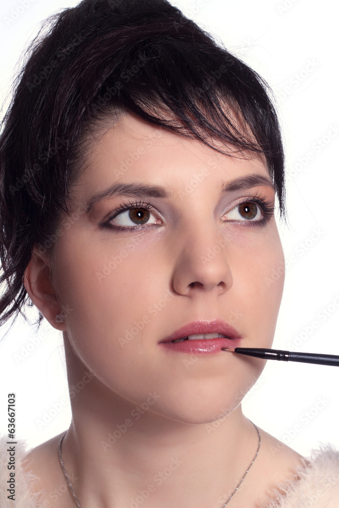 Woman paints lips Woman paints lips