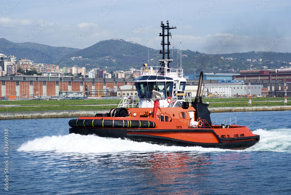 Fototapeta premium The tugboat in Genoa Harbour, Italy