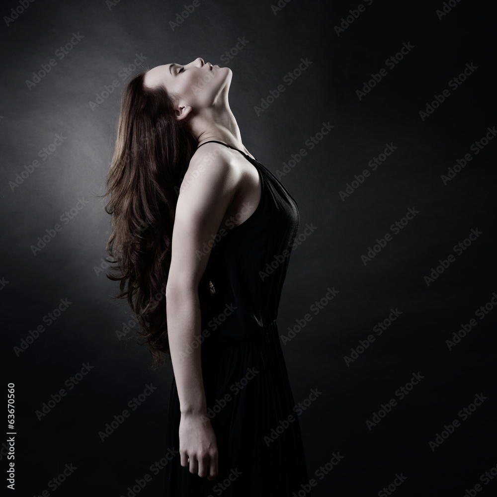 Young woman with beautiful long brown hair posing at studio, pro Young woman with beautiful long brown hair posing at studio, pro