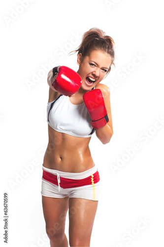 boxer woman during boxing exercise making direct hit with red gl