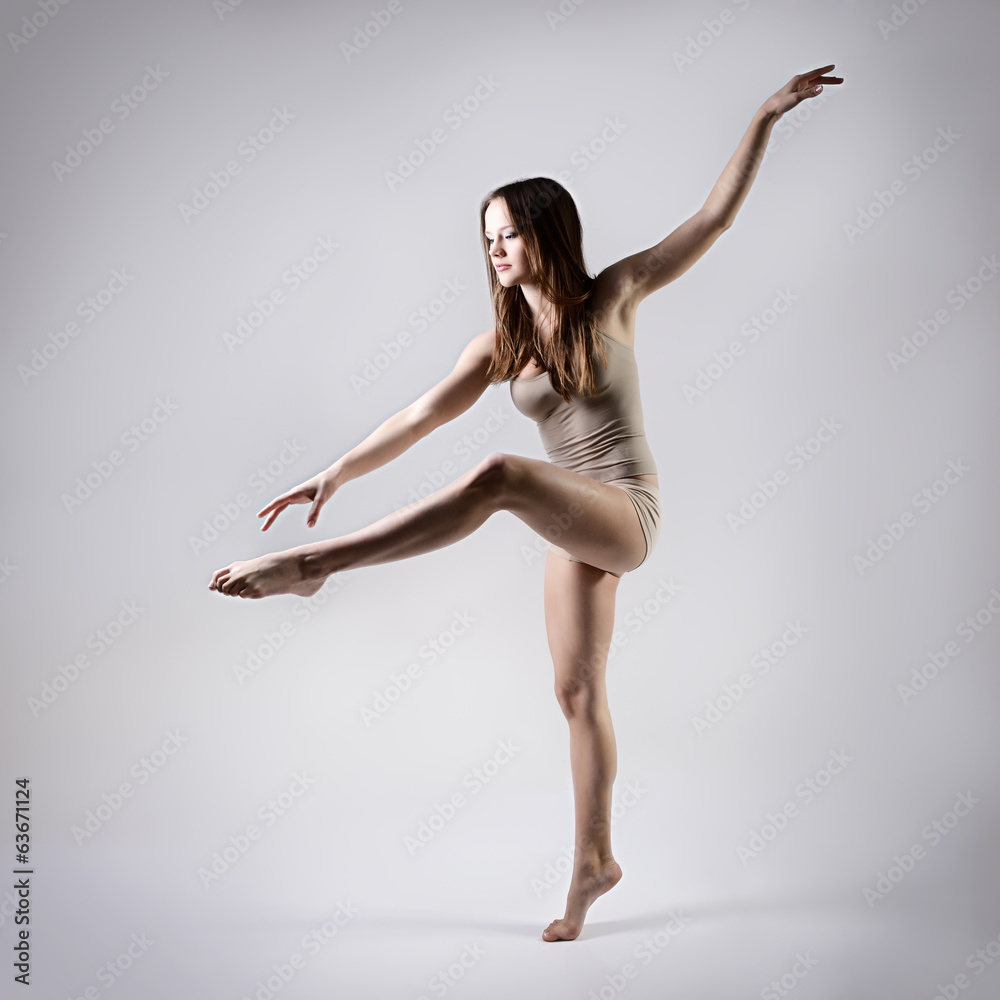 Obraz premium young beautiful dancer teen girl dancing and jumping, studio ser