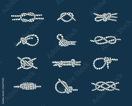 white natical rope knots over blue background photo
