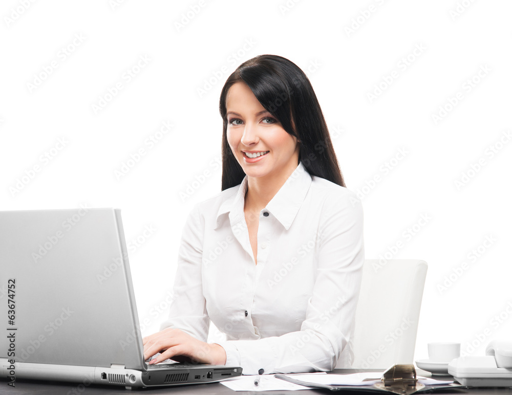 A businesswoman working in an office isolated on white A businesswoman working in an office isolated on white