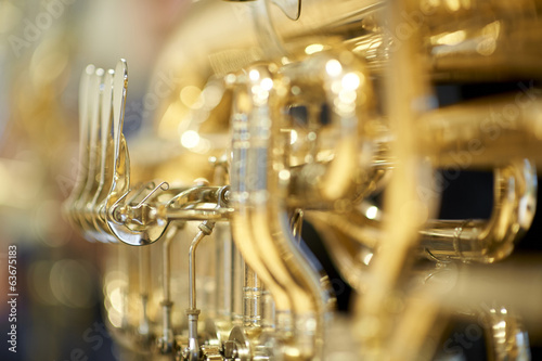 Tuba with valves and tubes close-up photo