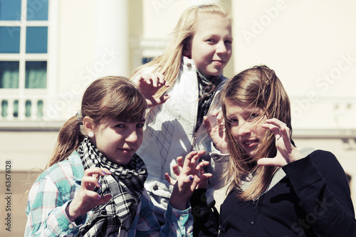 Group of teenage girls having a fun in campus