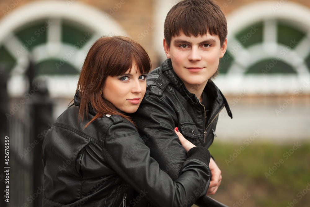 Happy young couple in leather jackets outdoor Happy young couple in leather jackets outdoor