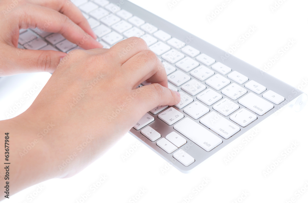 Closeup of business woman hand typing on laptop keyboard with mo Closeup of business woman hand typing on laptop keyboard with mo