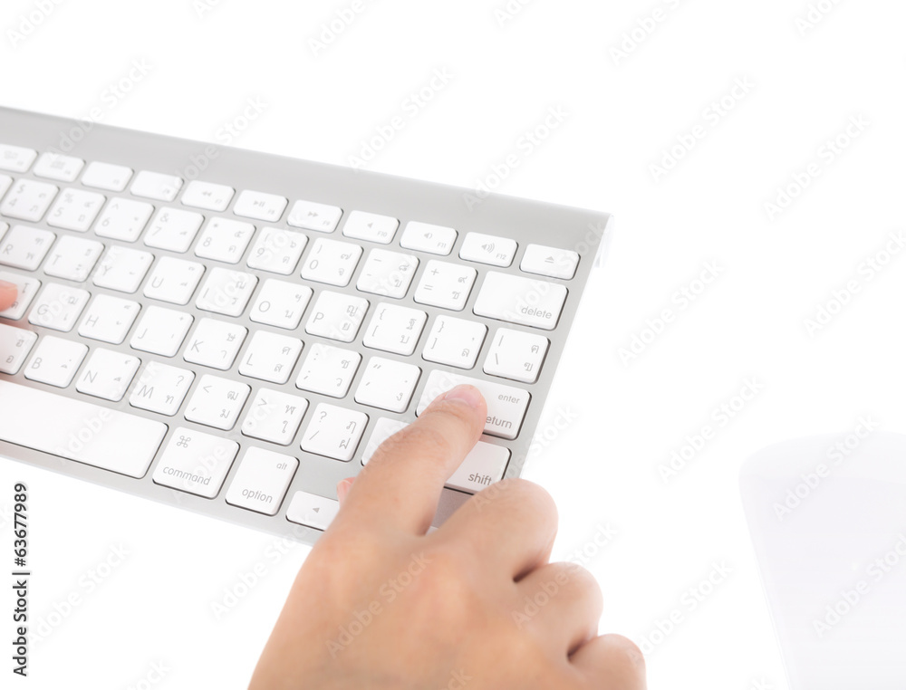 Closeup of business woman hand typing on laptop keyboard with mo Closeup of business woman hand typing on laptop keyboard with mo