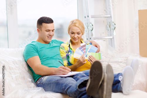 couple looking at color samples in new home