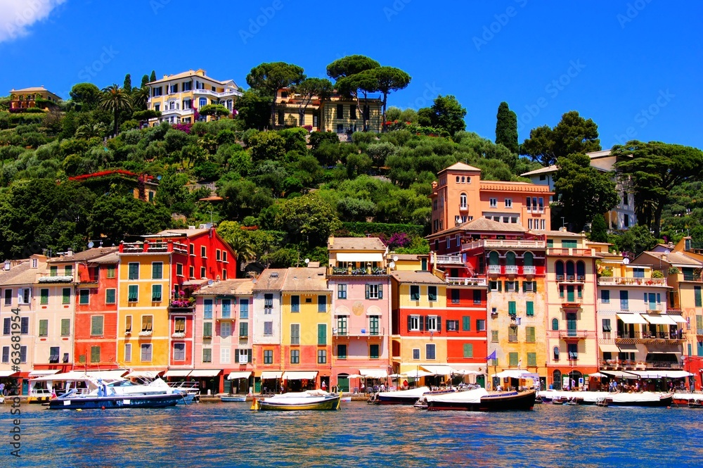 Colorful houses of the harbor at Portofino, Italy with boats