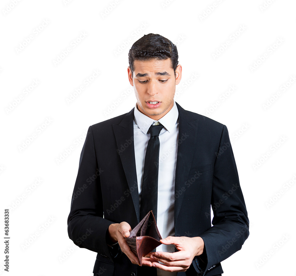Sad, surprised business man holding empty wallet Sad, surprised business man holding empty wallet