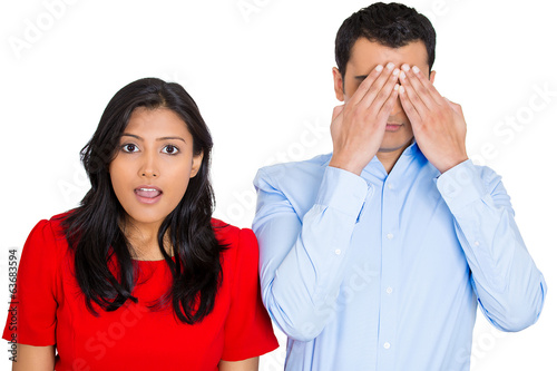 Emotion contrast, woman looks, man hides covers eyes 