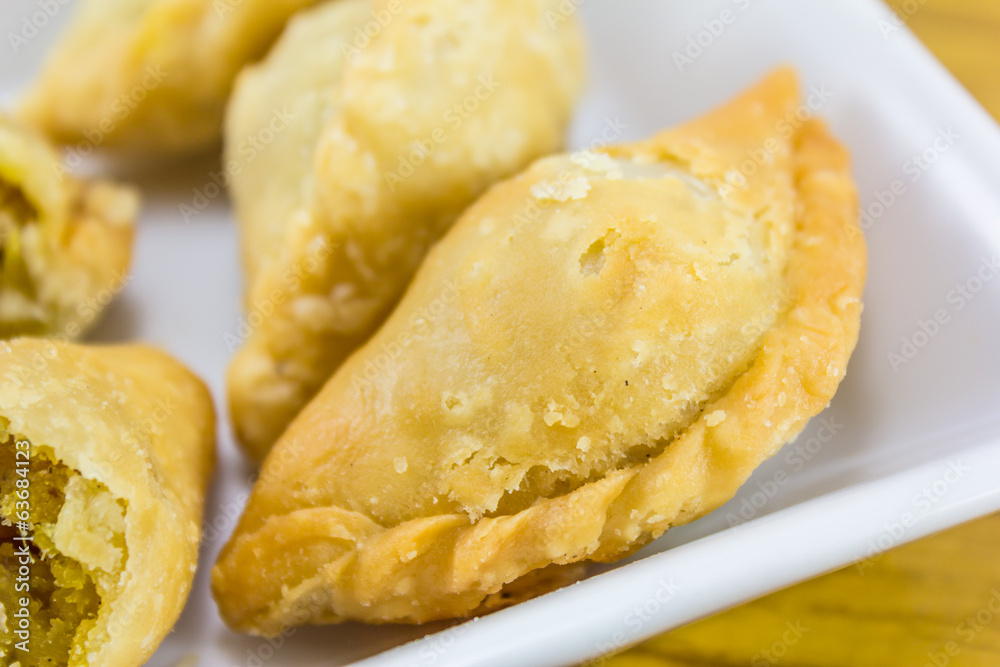curry puffs on white plate