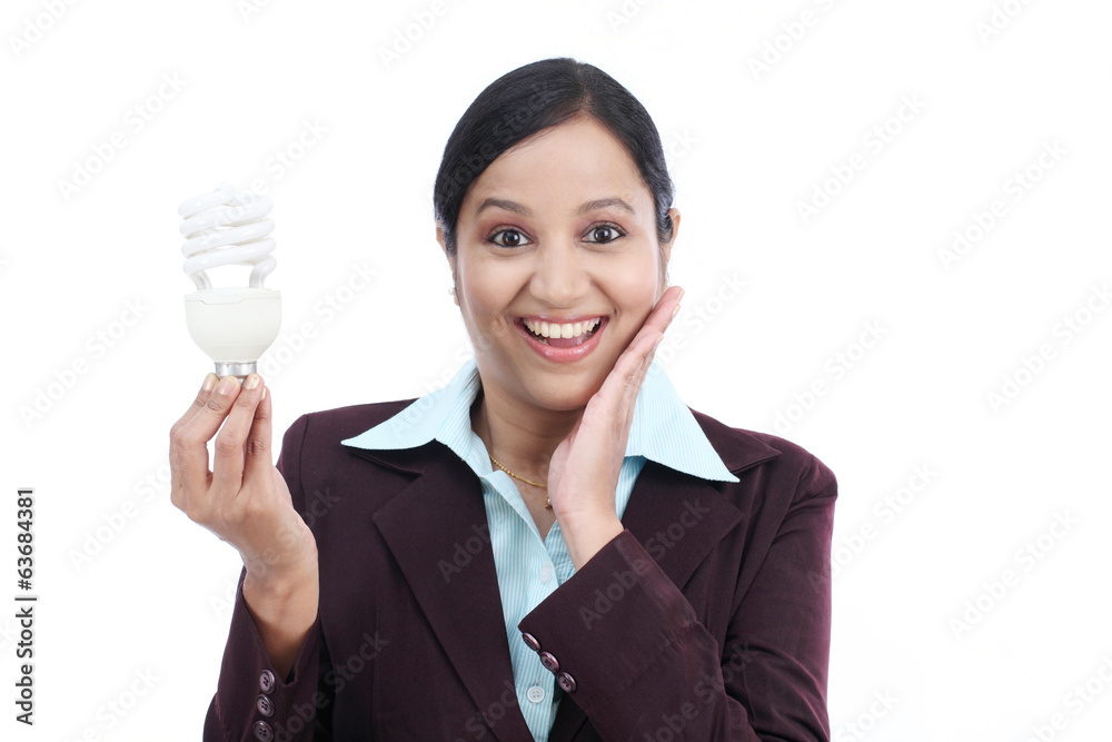Young Indian business woman holding bulb Young Indian business woman holding bulb