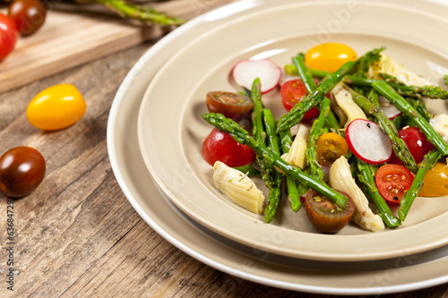 Vegetable salad with asparagus and tomato