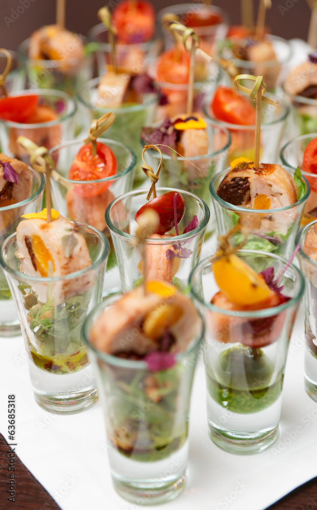 Fototapeta premium Various snacks in shot glasses