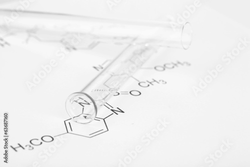 Test tubes and reaction formula, close-up