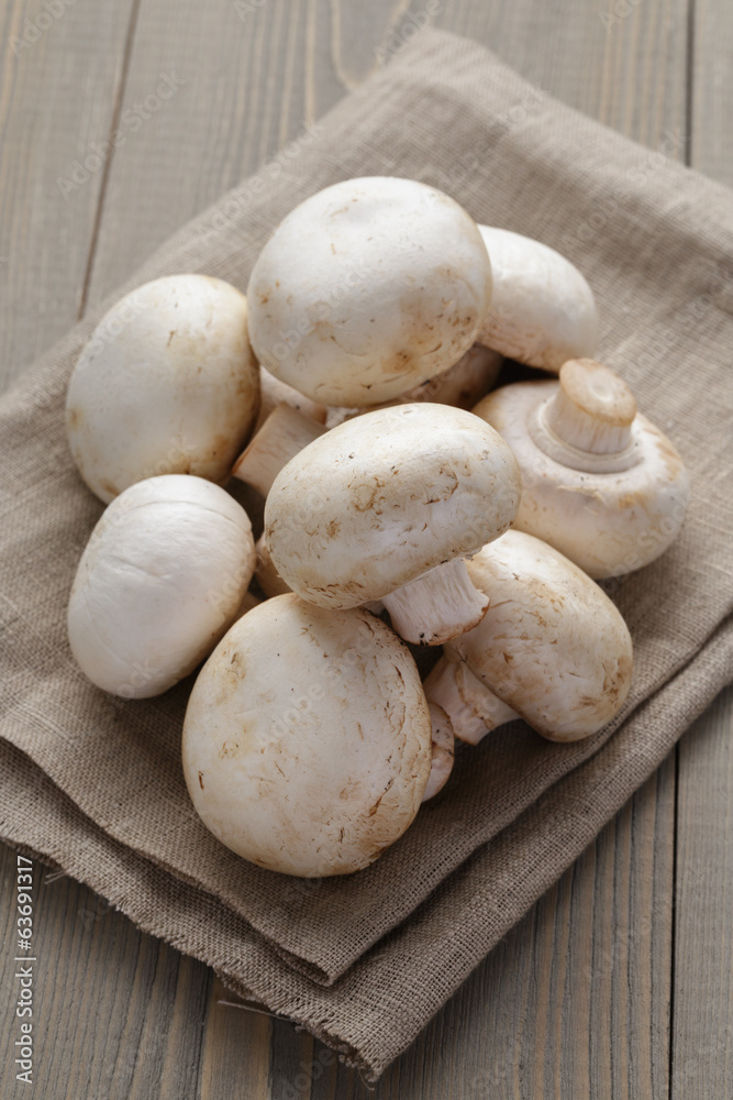fresh white champignon on wood table fresh white champignon on wood table