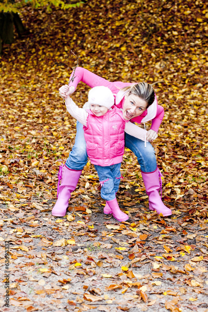 mother with her daughter in autumnal nature mother with her daughter in autumnal nature