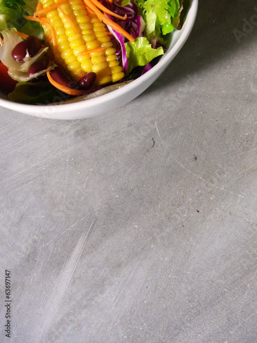 mixed salad bowel on cement background