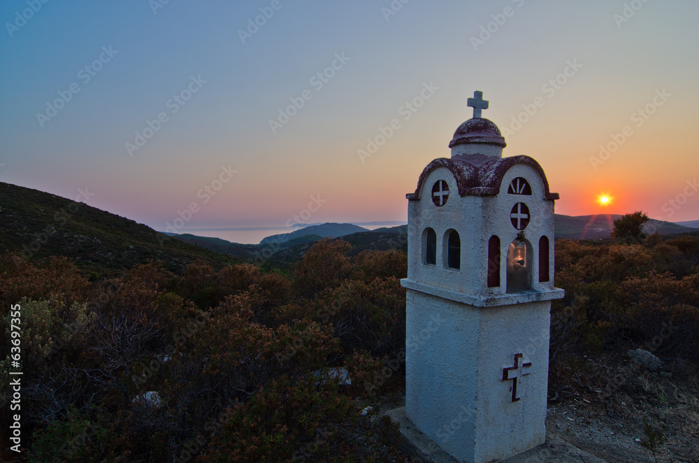 Small church or chapel with typical Greek landscape at sunset Small church or chapel with typical Greek landscape at sunset