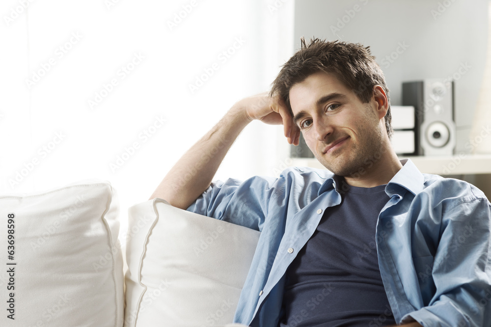 Young man relaxing on sofa