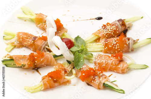 Rolls of salmon with cucumber and caviar photo