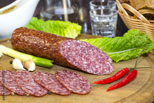 sausage on a wooden plate in a restaurant