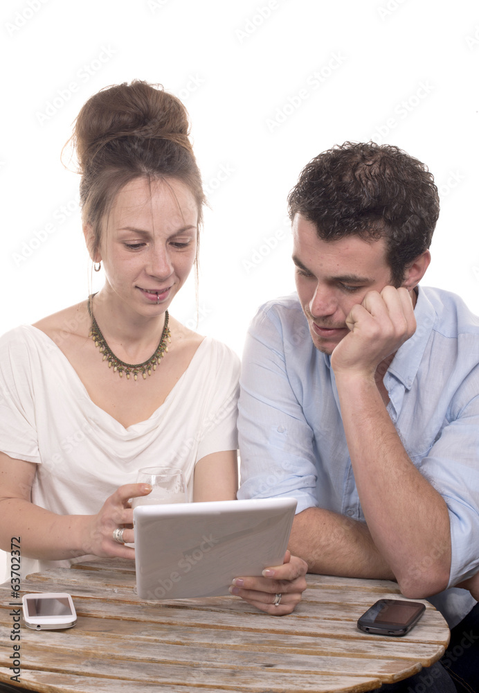 young couple looking at a tablet computer